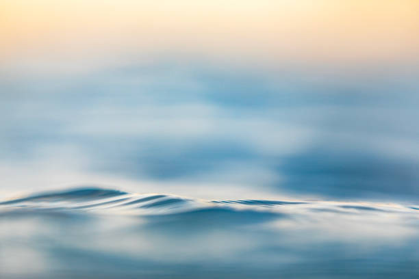 Soft ocean wave at sunrise